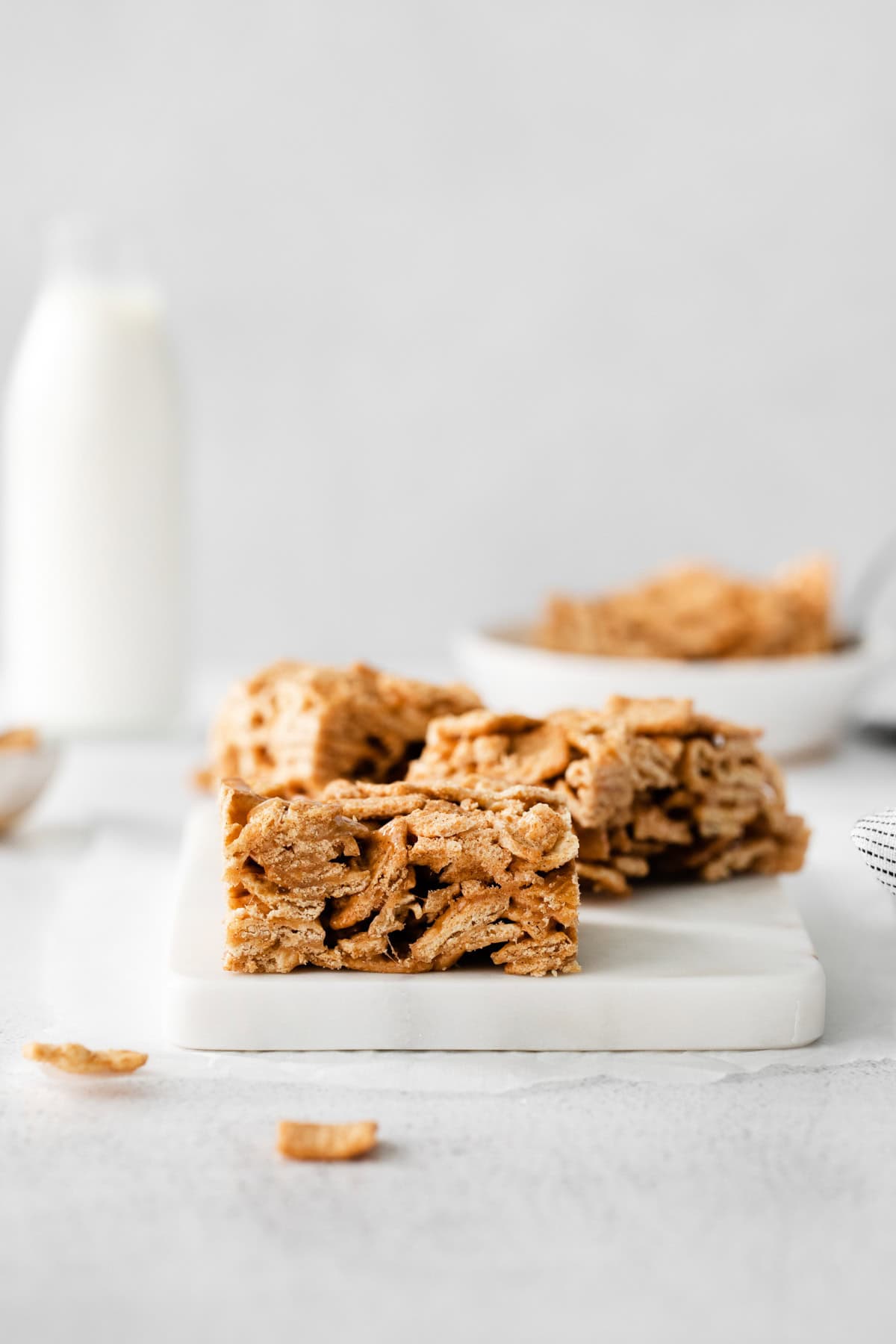 Cinnamon Toast Crunch Cereal Bars on a marble tray. 
