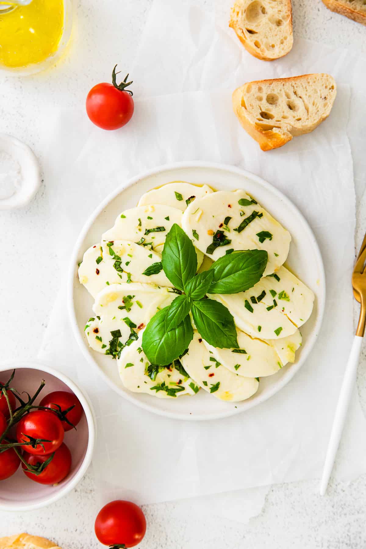 Marinated Mozzarella on a white plate. 
