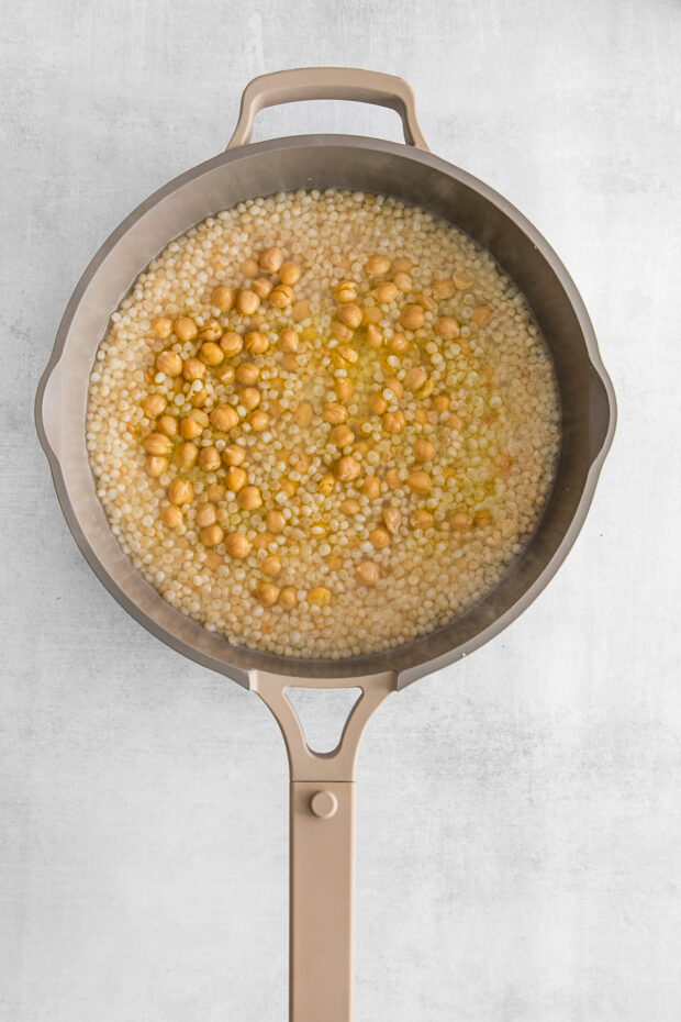 Couscous in a pan with chickpeas.