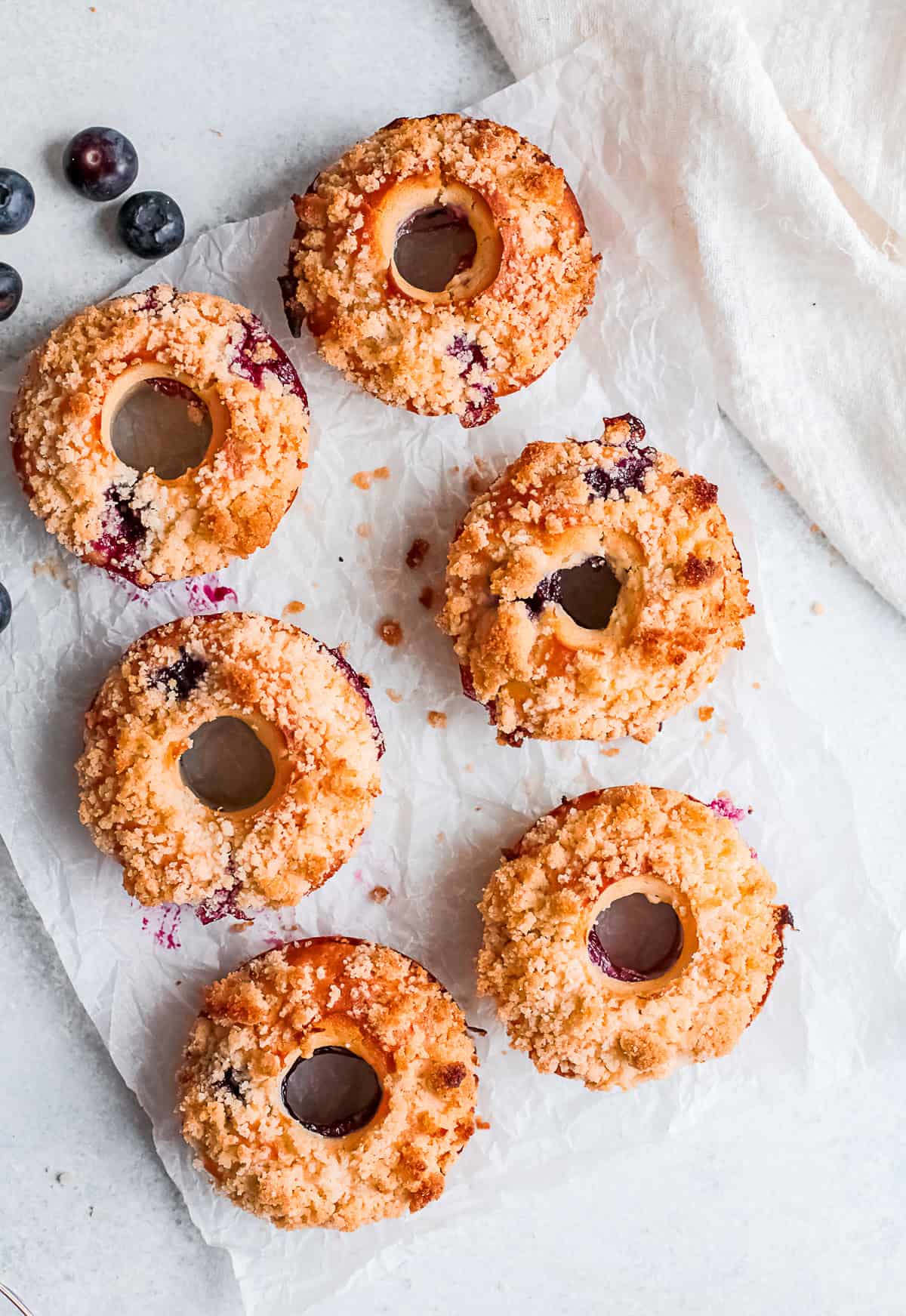 Baked Blueberry Streusel Donuts served on a table.