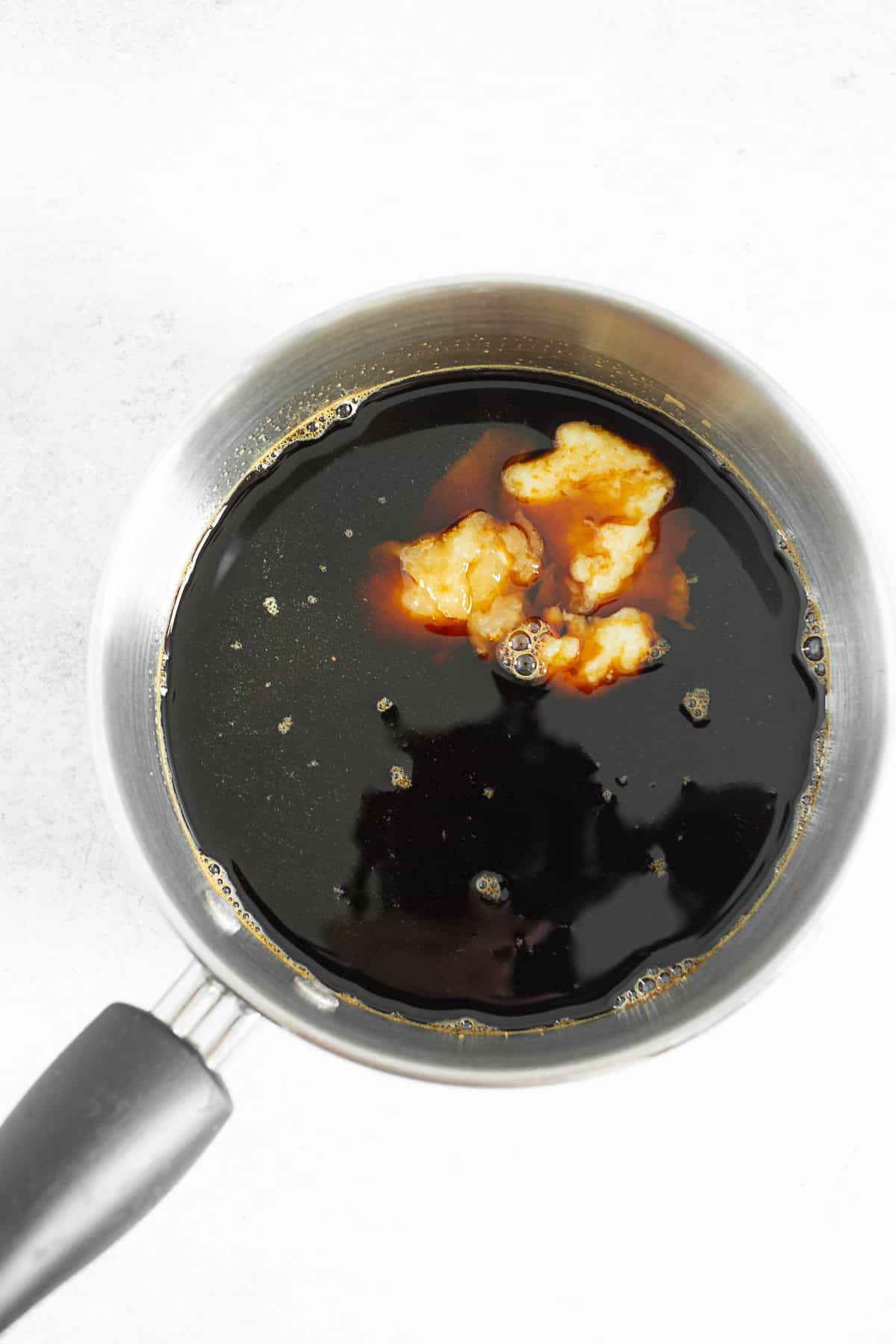 Teriyaki sauce cooking in a pot.