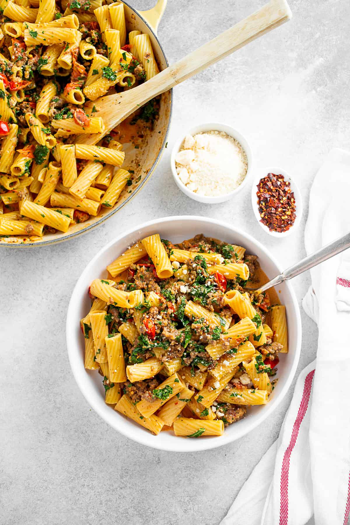 Italian Sausage Kale Pasta served with Parmesan cheese and crushed red pepper. 