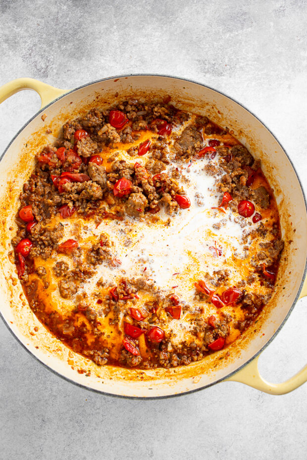 Heavy cream mixed in with Italian sausage and tomatoes. 