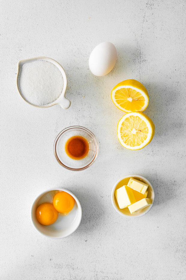 Ingredients to make lemon curd on the table. 