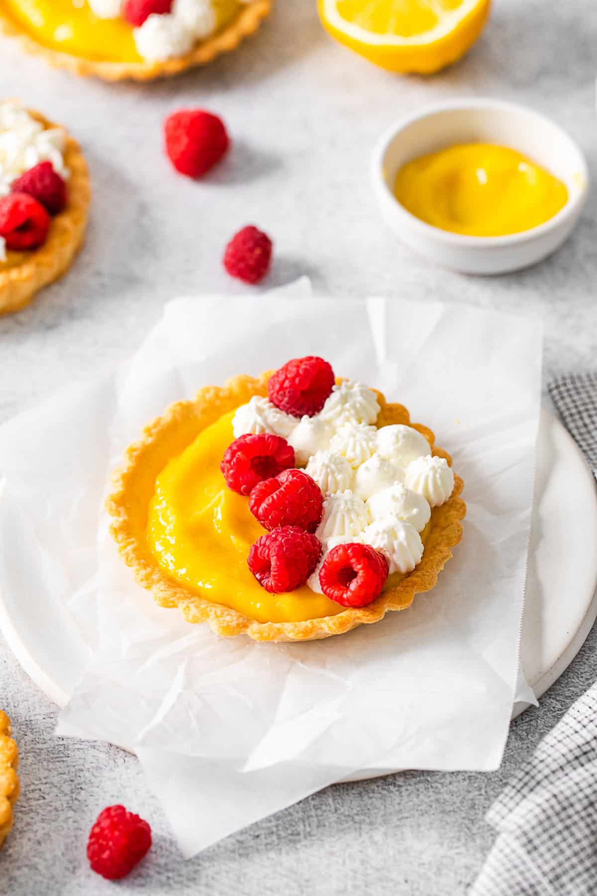 Lemon Curd Tarts on parchment paper. 