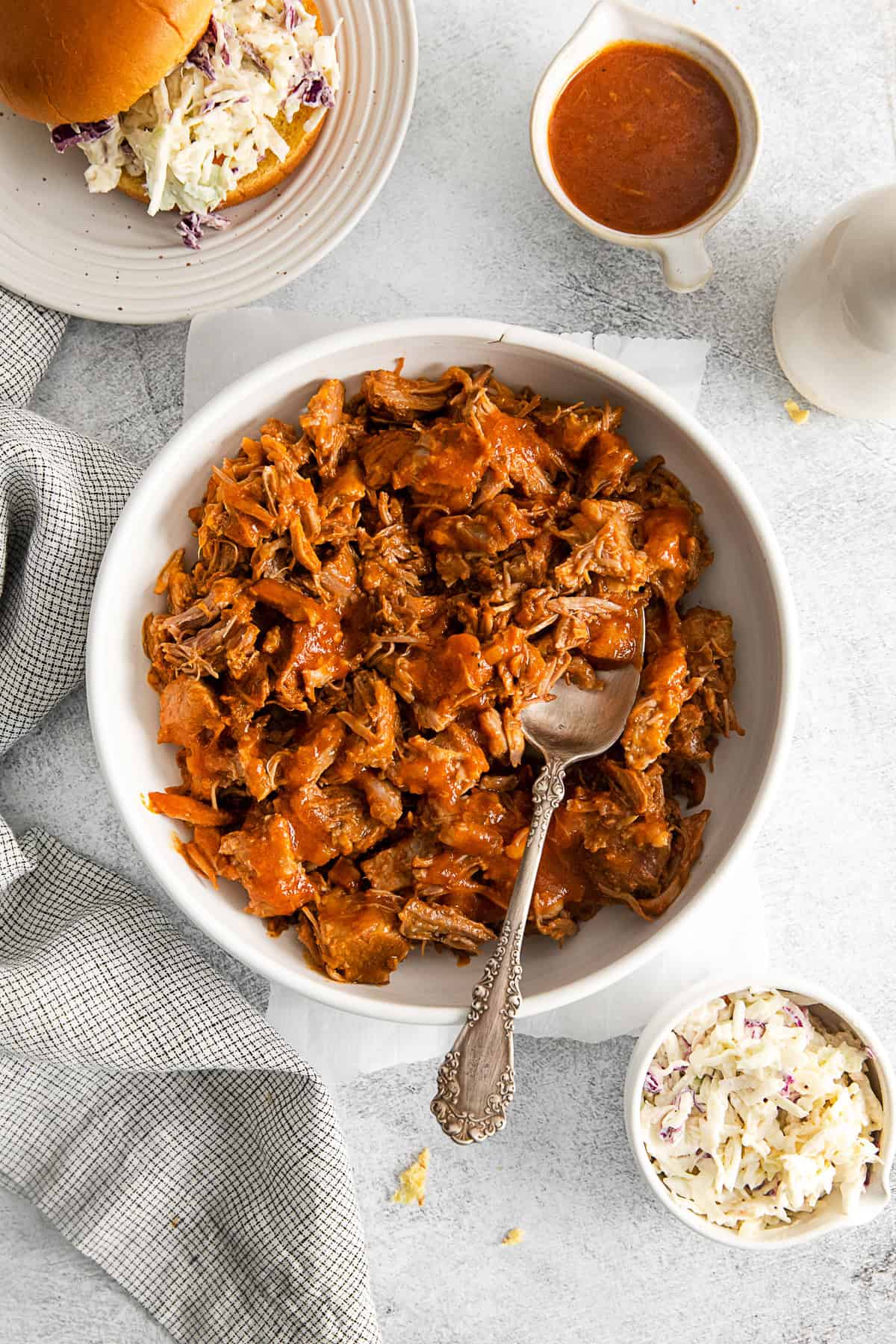 Slow Cooker BBQ Pulled Pork in a bowl with a spoon. 