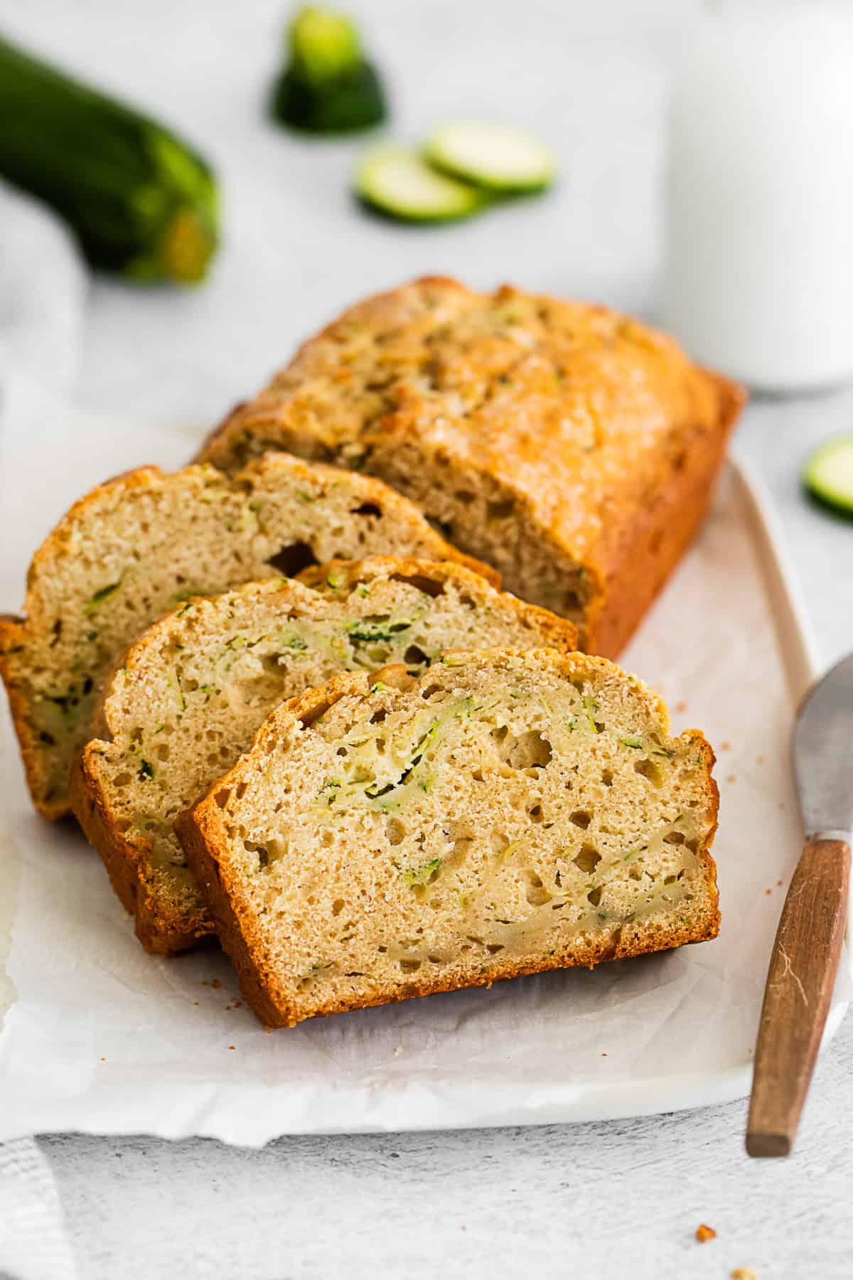 Zucchini Bread sliced on a serving platter.