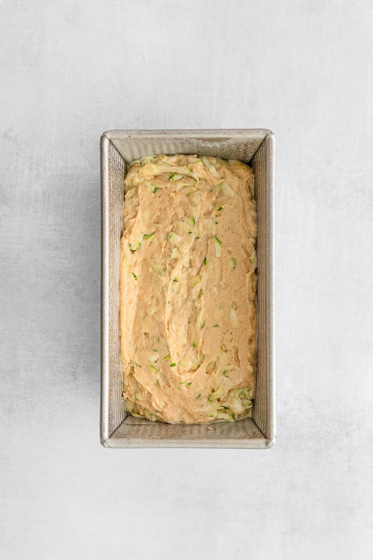 Uncooked Zucchini Bread in a pan.