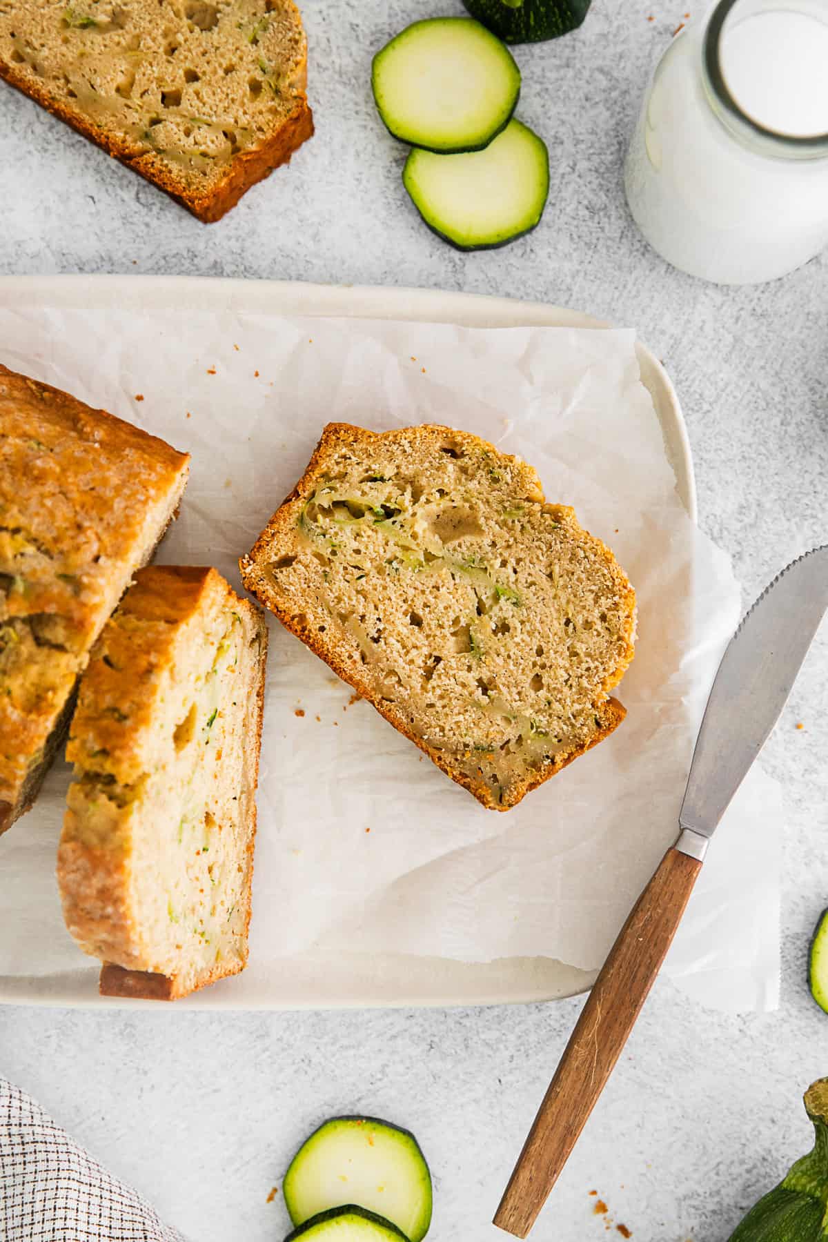 Zucchini Bread sitting on parchment paper.