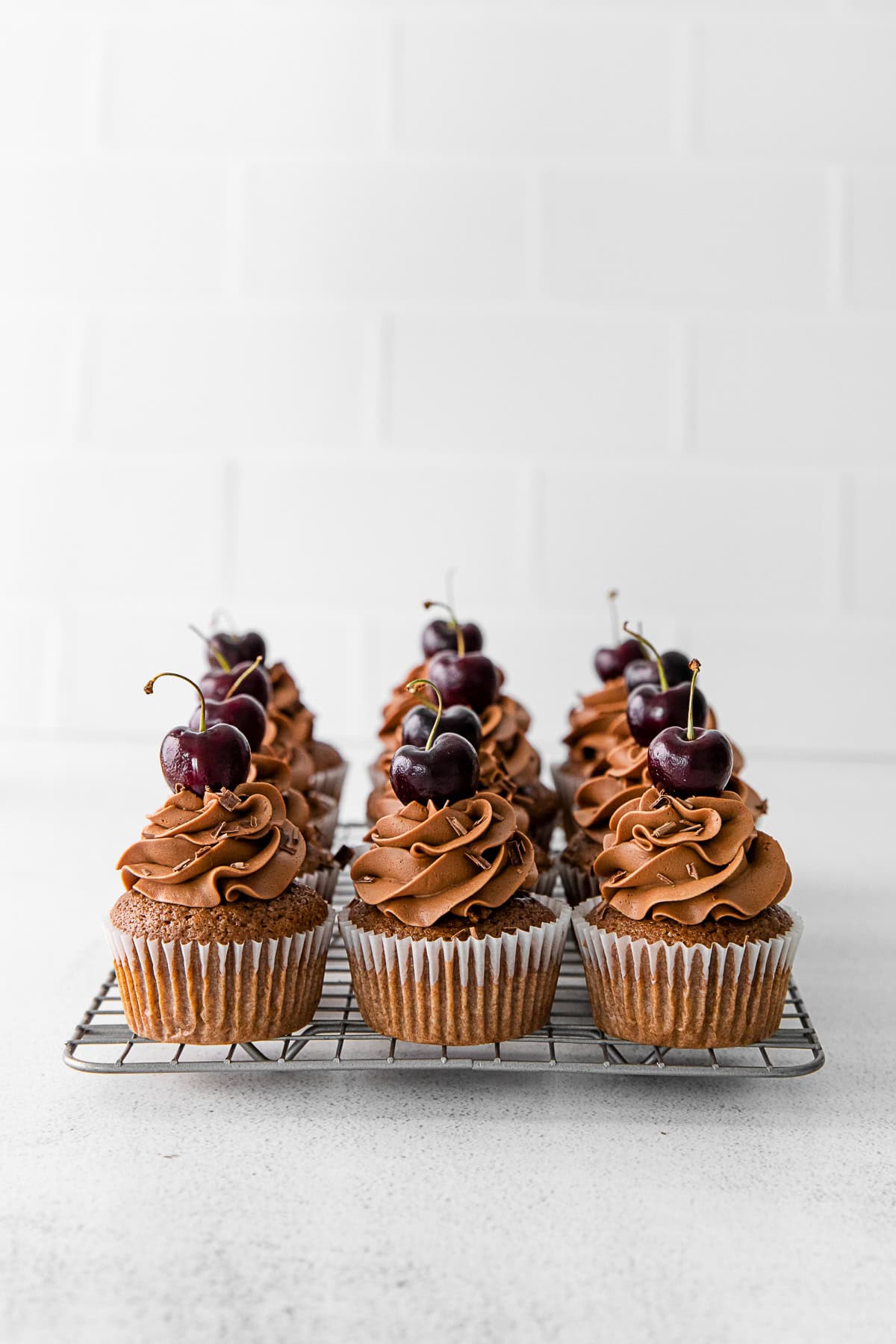 Black Forest Cupcakes on a cooling tray. 