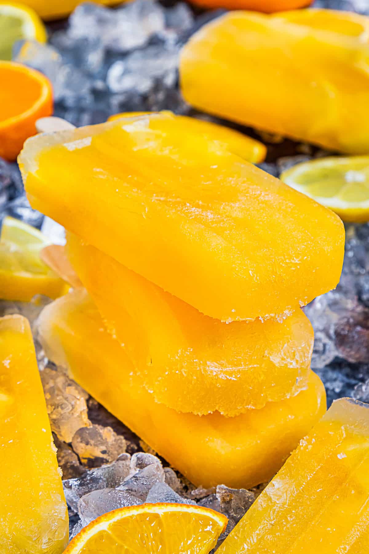 Citrus Popsicles stacked on top of each other.