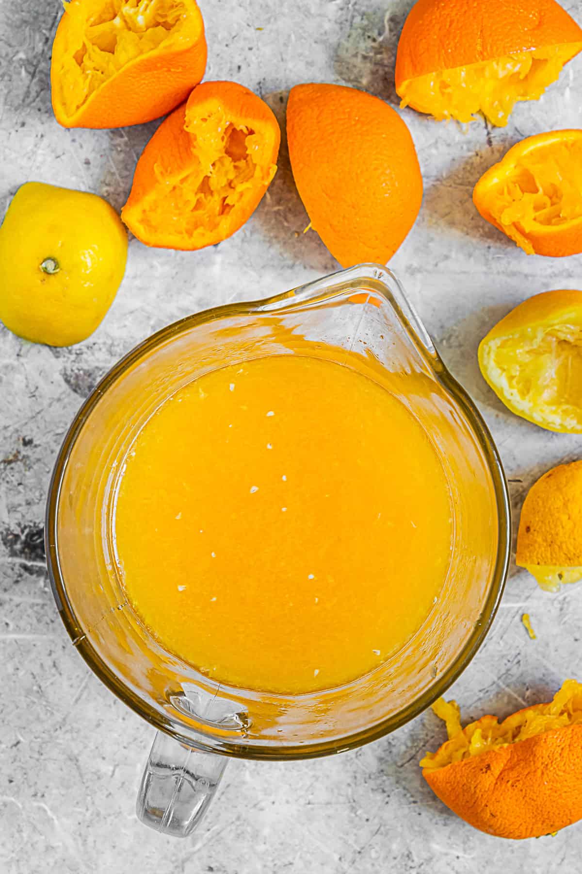 Fresh orange and lemon juice in a pitcher.
