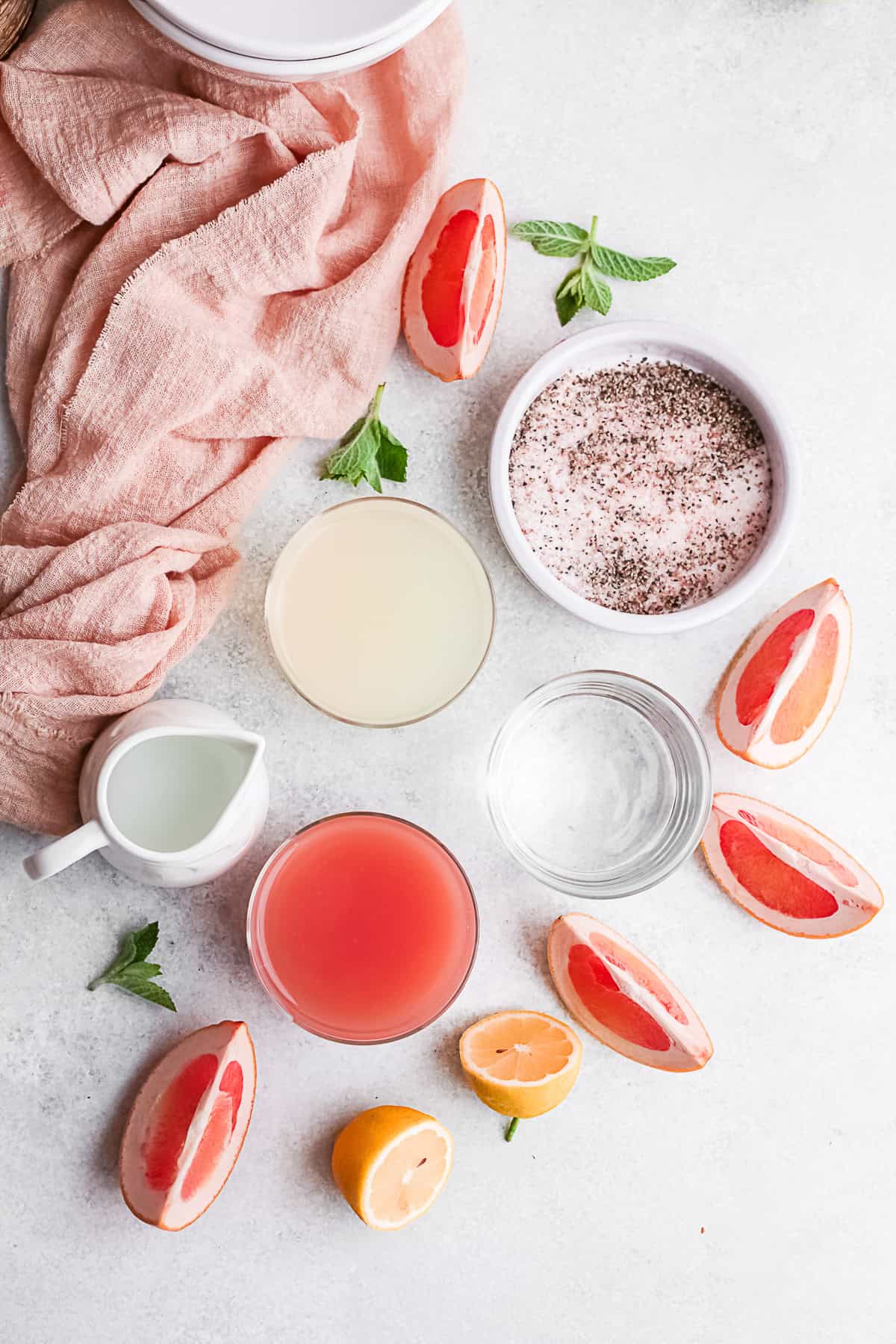 Ingredients to make Grapefruit Paloma on a table. 