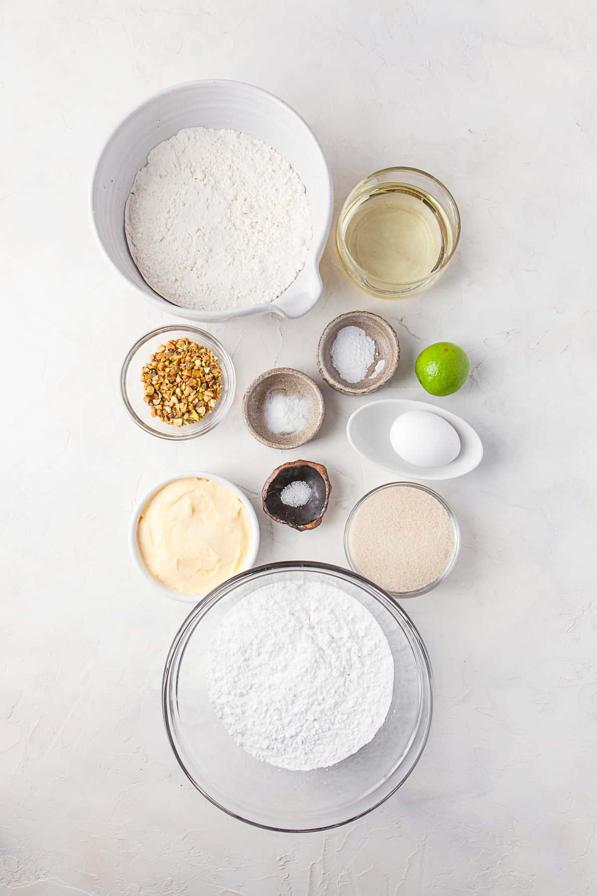 Ingredients to make Lime Glazed Sugar Cookies on a table. 