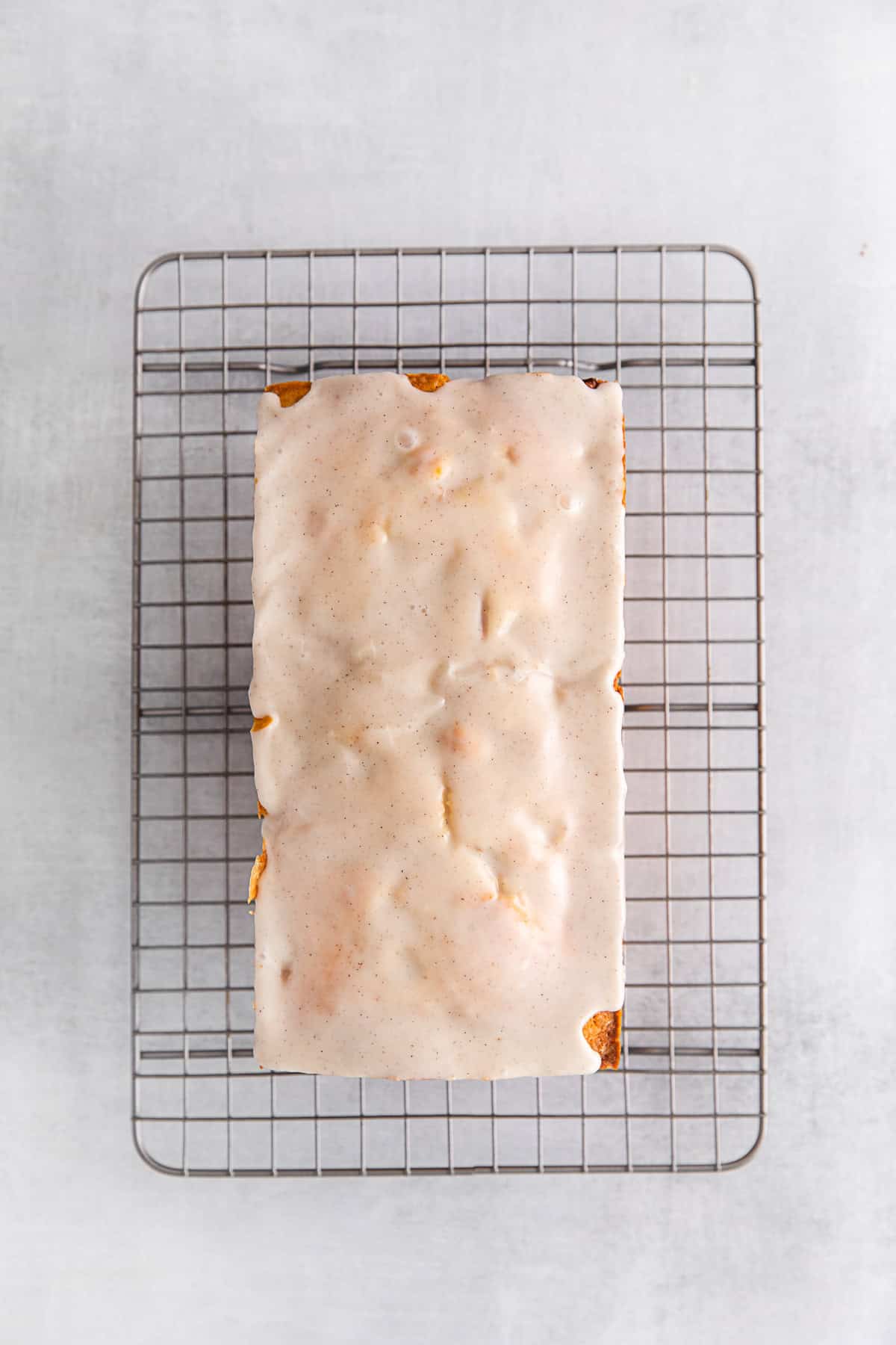 Vanilla glaze poured over cake. 