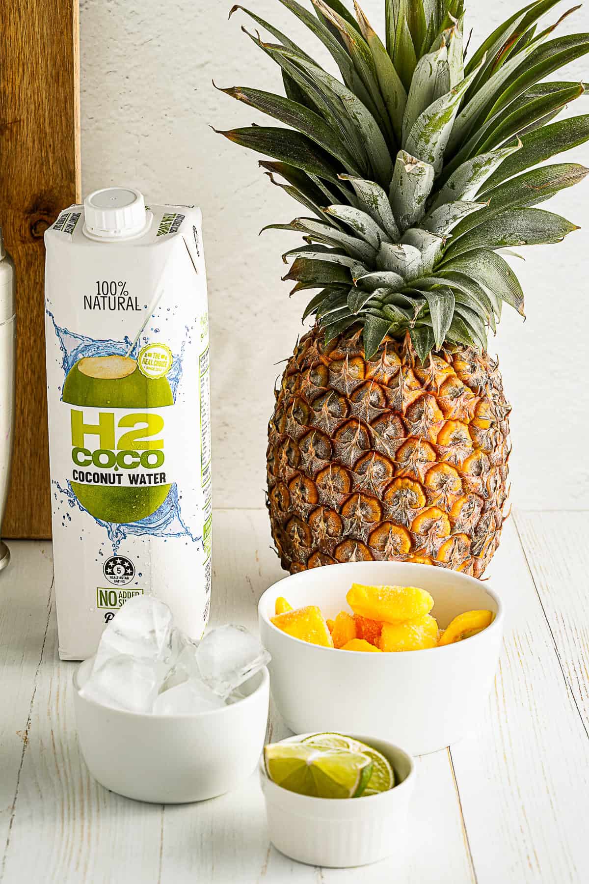 Mango Pineapple Smoothie ingredients on a table. 