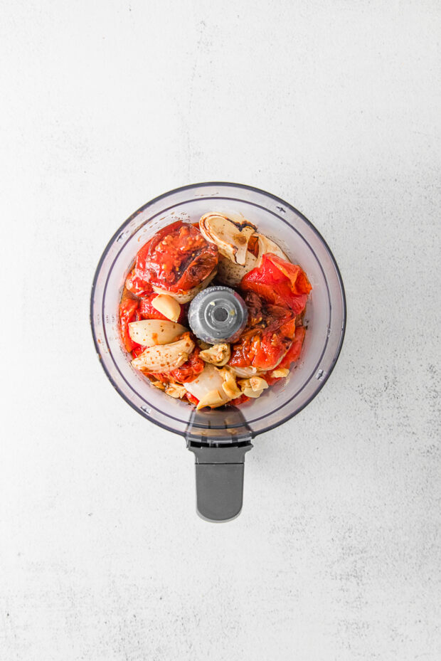 Roasted tomatoes and onion in a food processor. 
