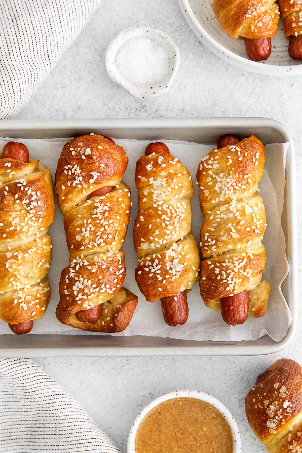 Soft Pretzel Dogs on a sheet pan. 