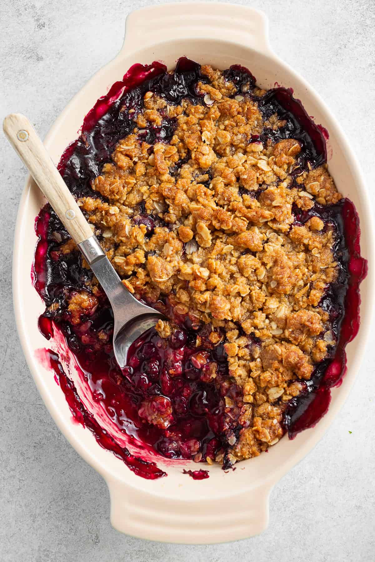 Taking a scoop out of triple berry crisp. 