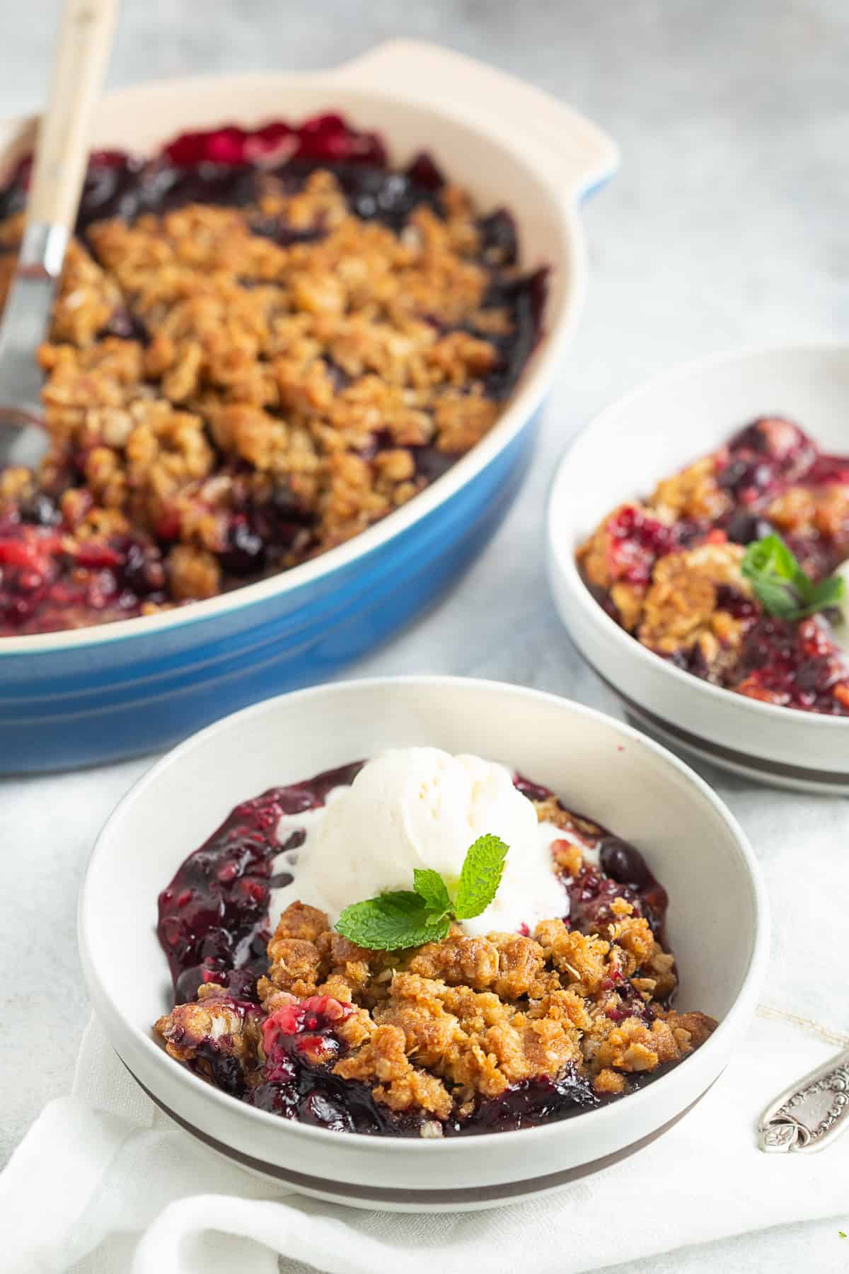 Triple Berry Crisp topped with vanilla ice cream. 