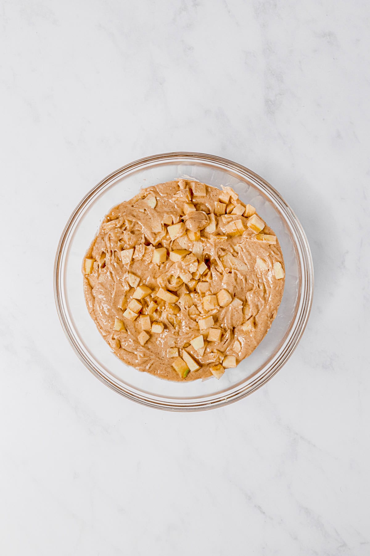 Apple bread batter in a bowl.