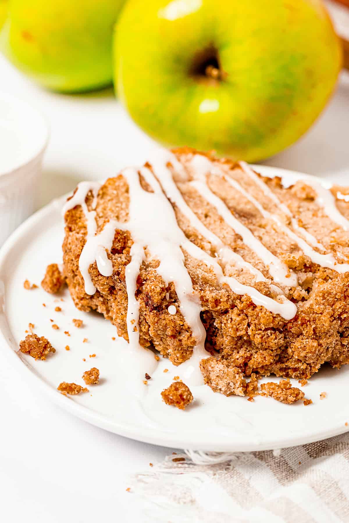 Apple Streusel Bread drizzled with glaze.