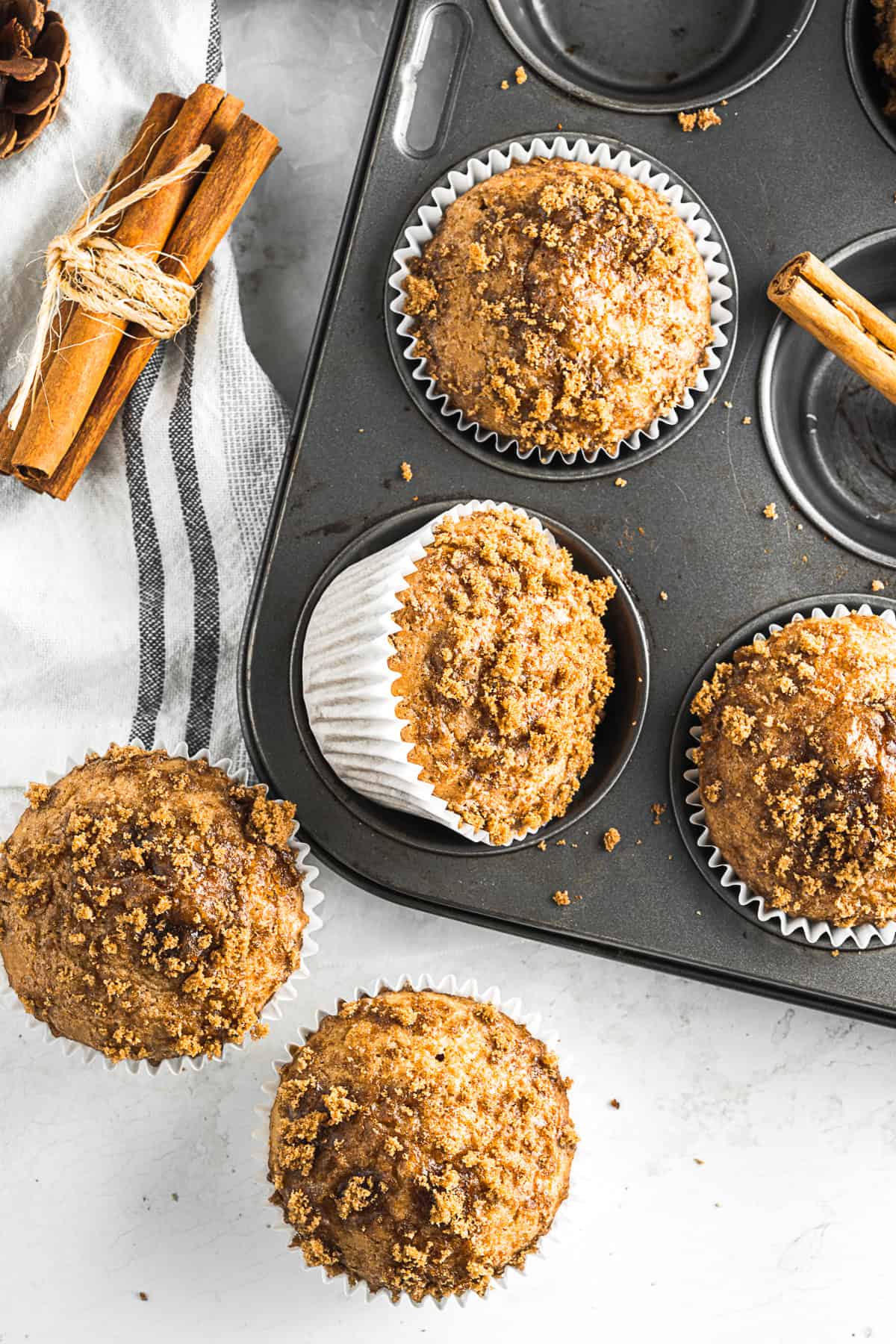 Applesauce Muffins in a metal muffin tin. 