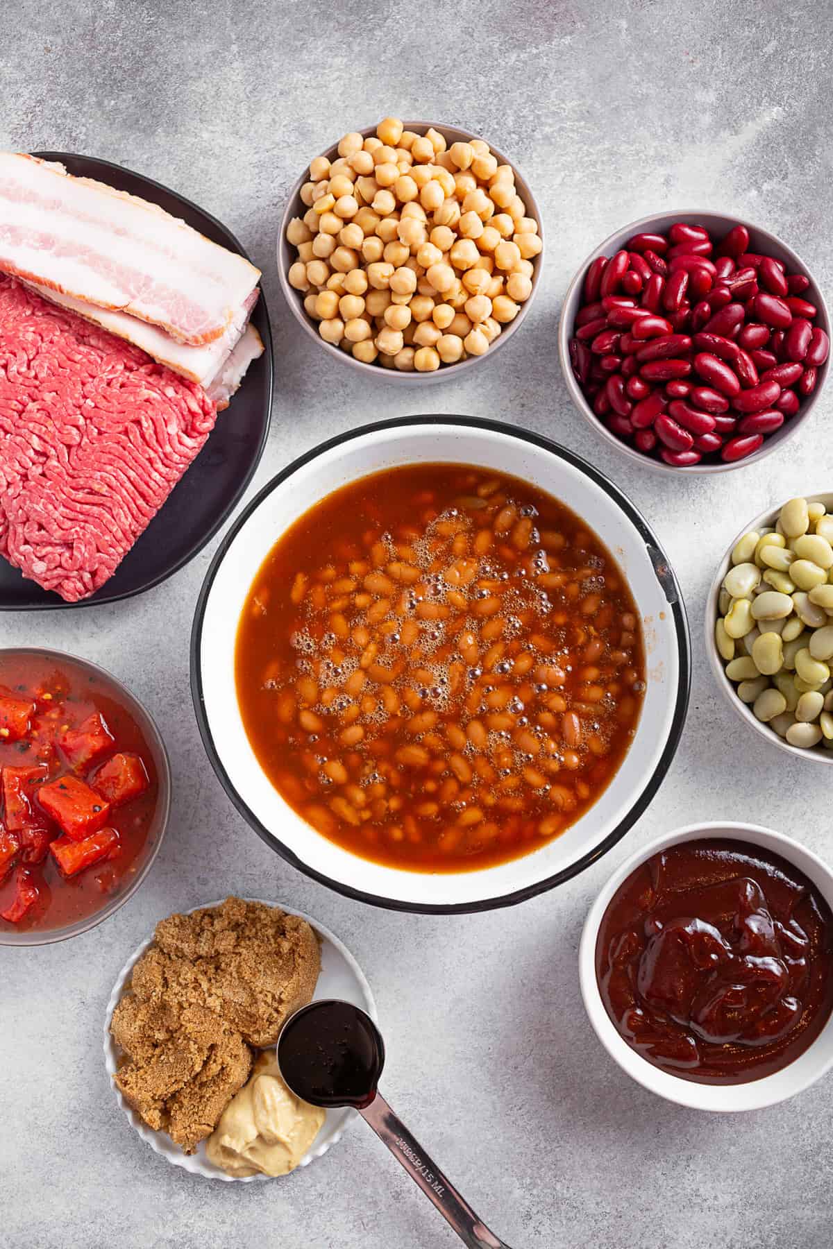 Ingredients for BBQ Calico Beans on a table. 