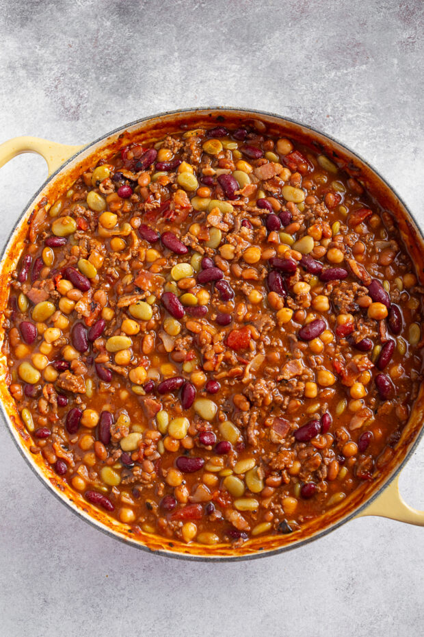 BBQ Calico Beans in a round yellow cooking dish. 