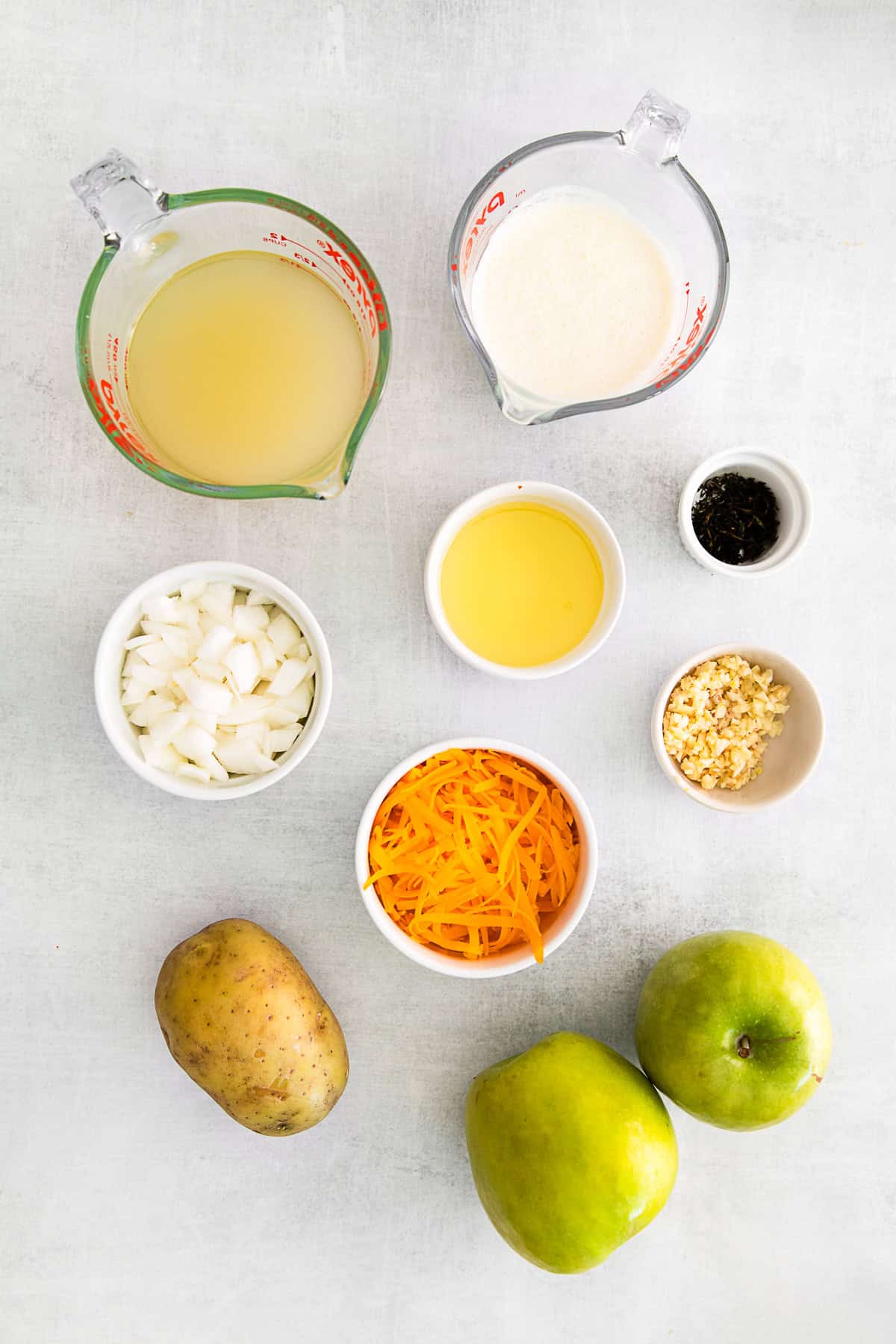 Apple Cheddar Soup ingredients on a table. 
