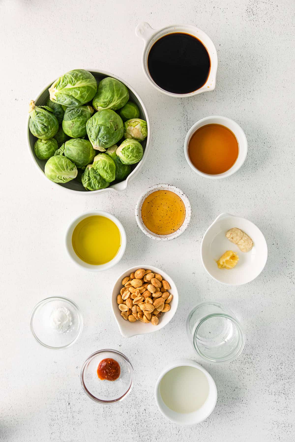 Ingredients to make Kung Pao Brussels Sprouts sitting on a table. 