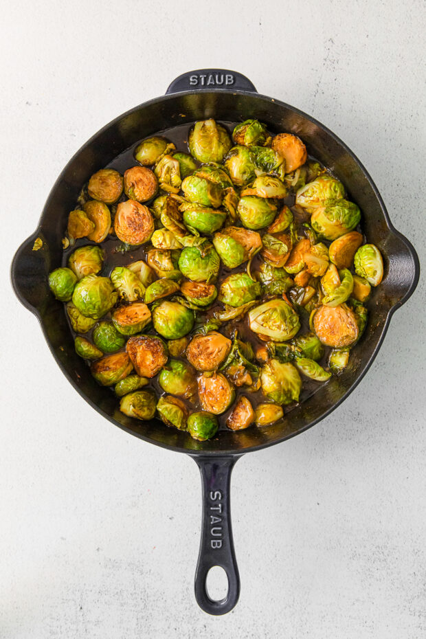 Kung Pao Brussels Sprouts in a cast iron skillet. 