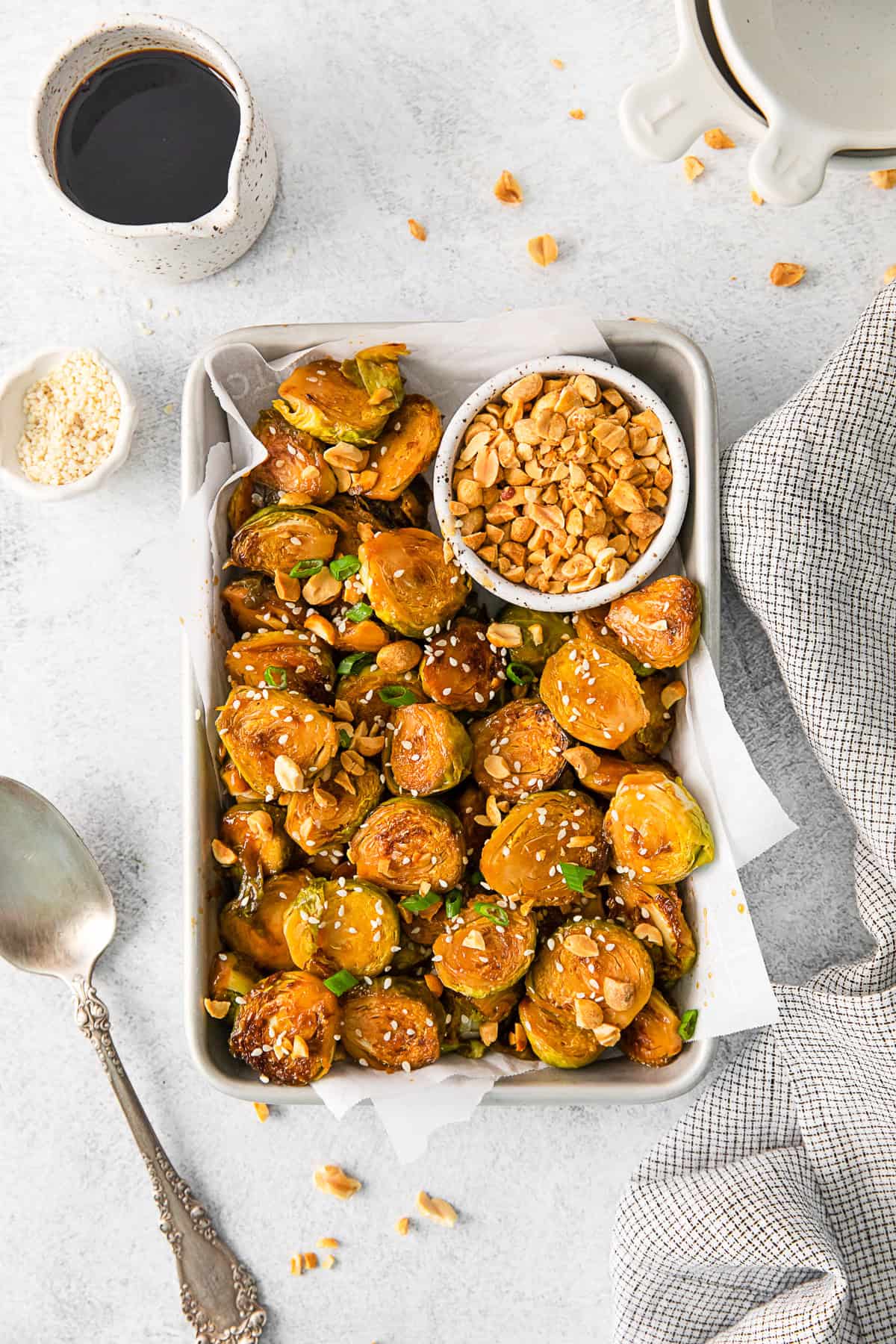 Kung Pao Brussels Sprouts served with crushed peanuts. 