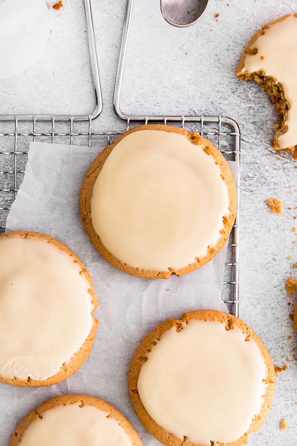Maple Glazed Cookies sitting on parchment paper. 