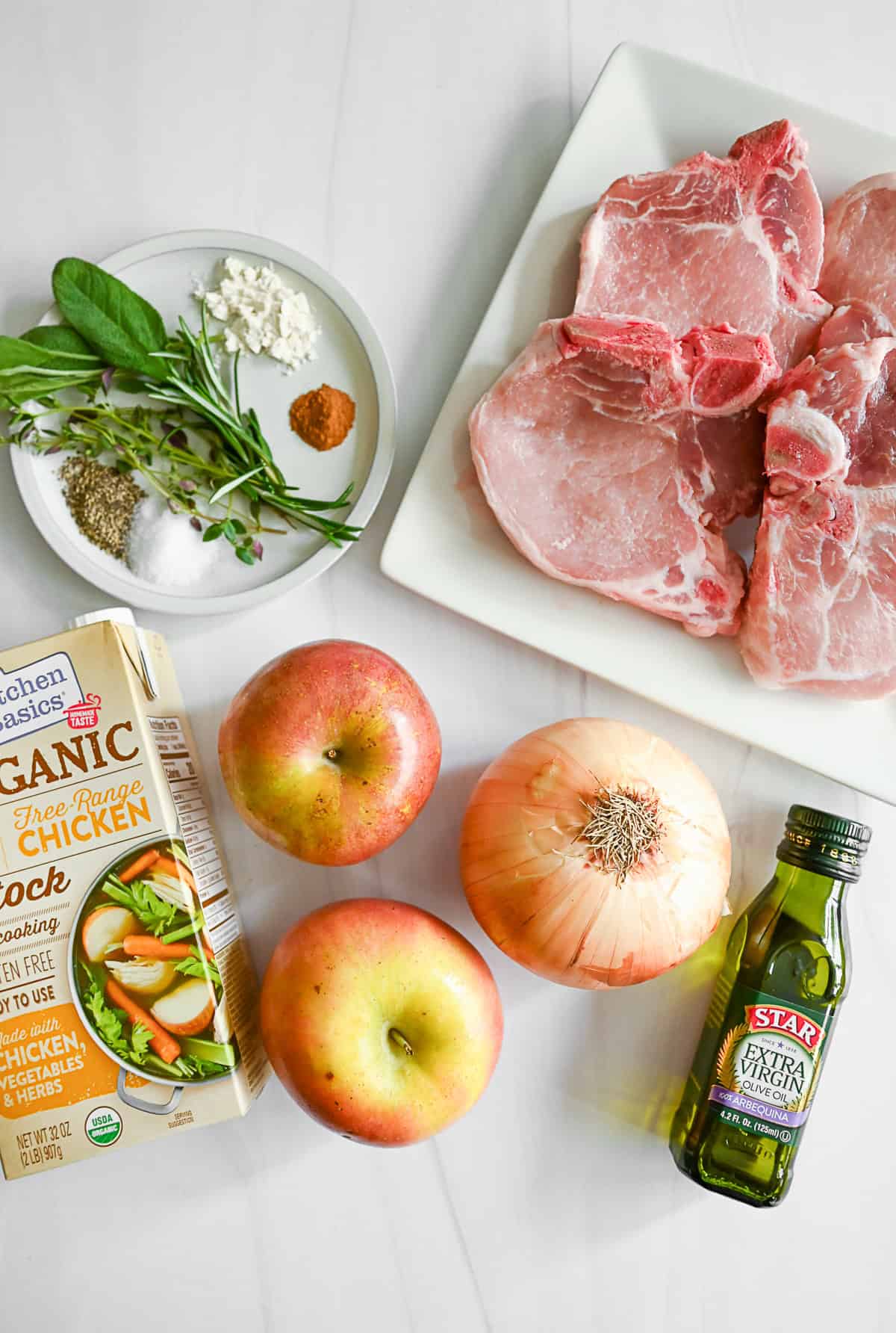 Pork Chops with Apples ingredients on a table. 