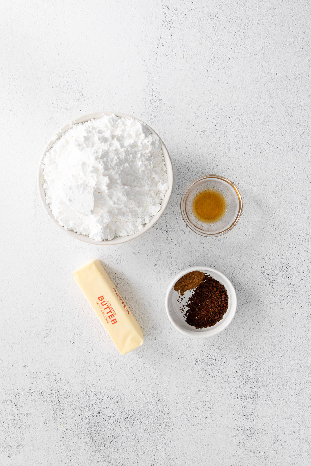 Ingredients to make frosting on a table. 