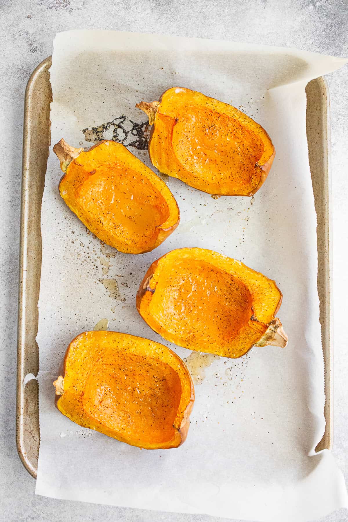 Roasted Koginut Squash on a sheet pan. 