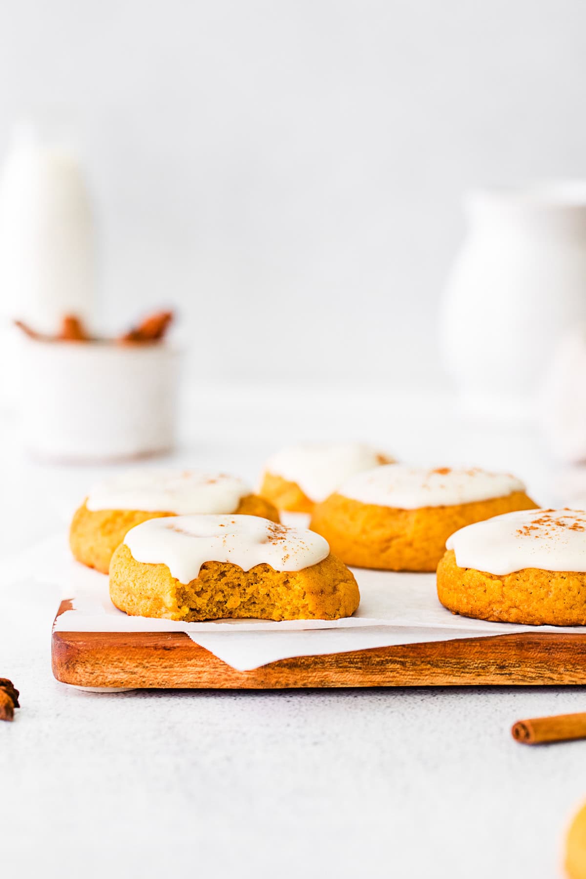 A Soft Pumpkin Cookie with a bite taken out of it. 