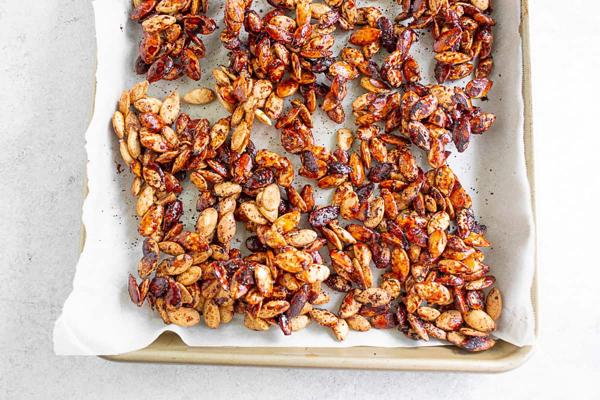 Sweet Salty Roasted Pumpkin Seeds on a sheet pan.