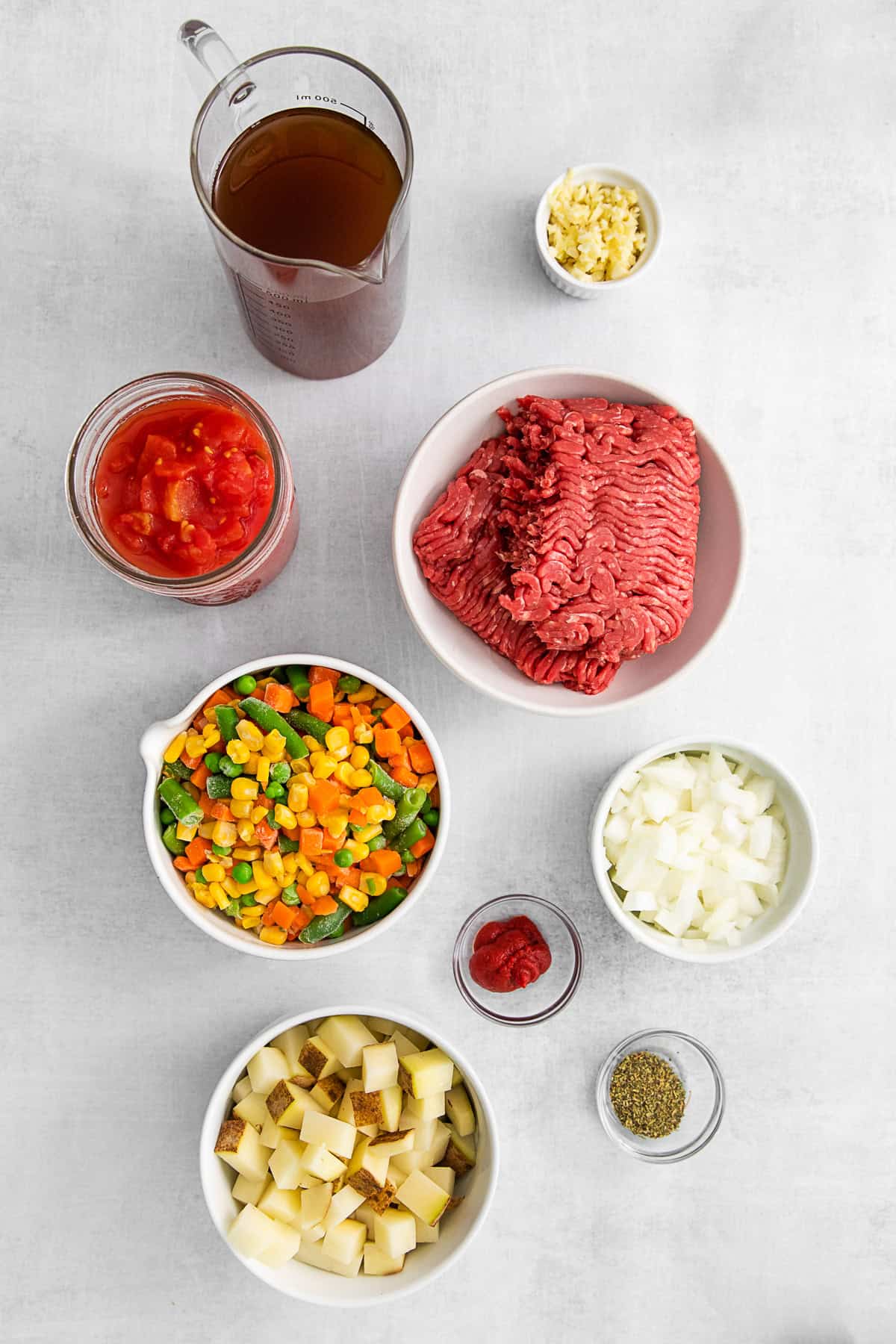 Ingredients for Vegetable Beef Soup on a table. 