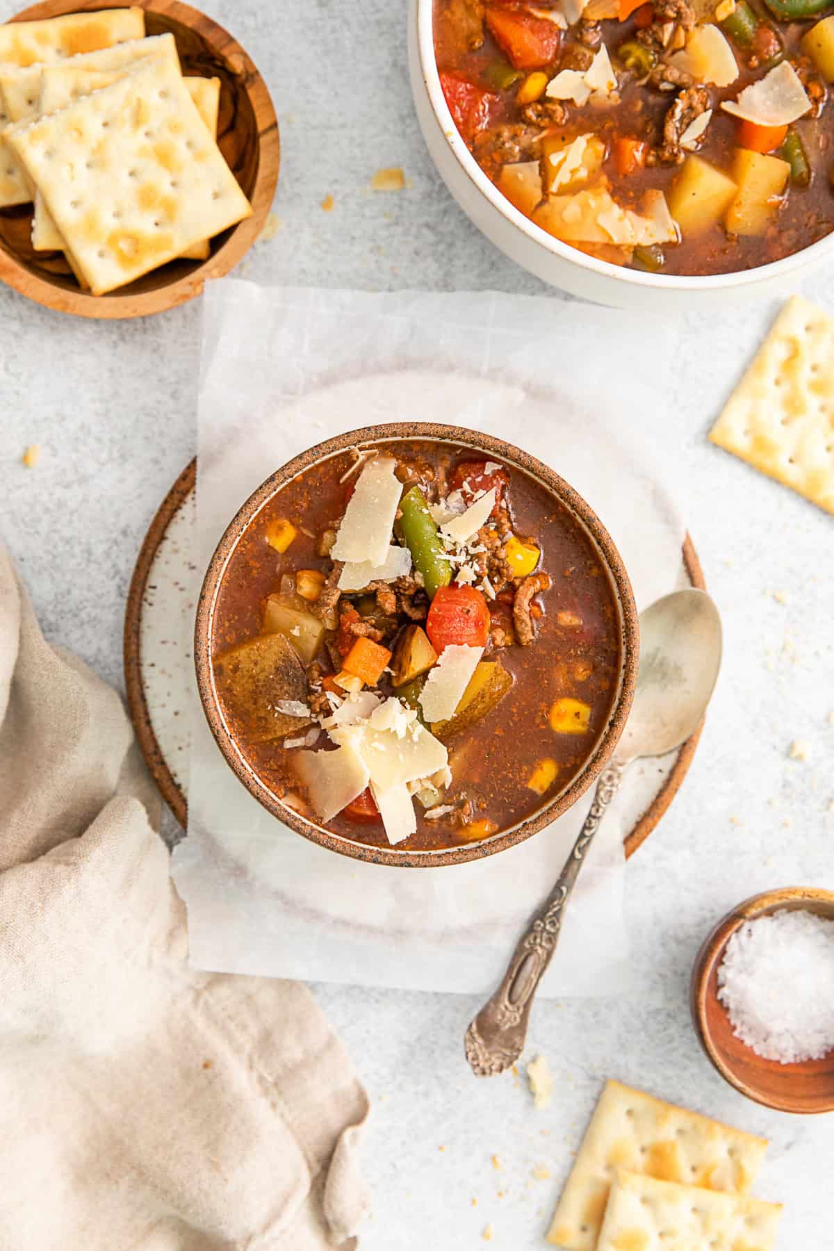 Vegetable Beef Soup topped with parmesan cheese. 