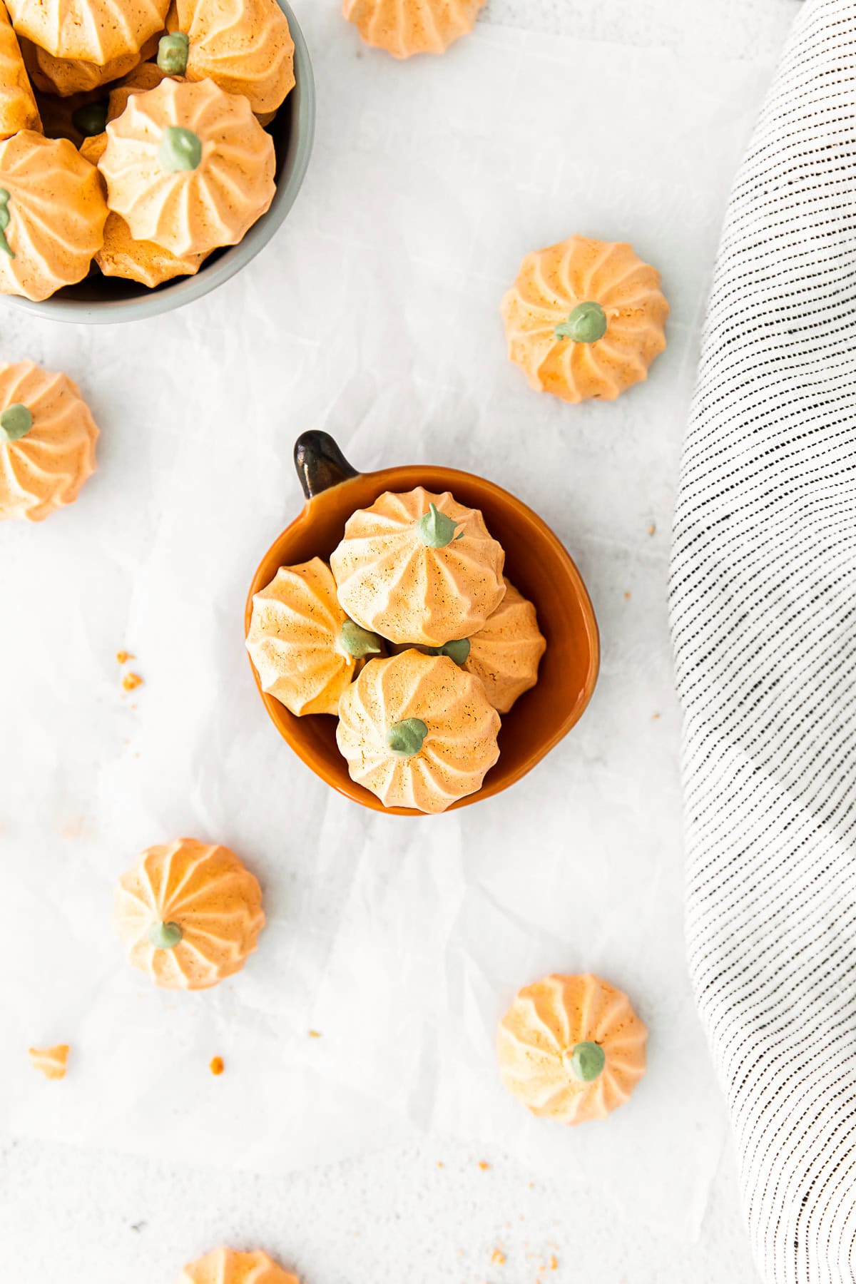 Pumpkin Spice Meringue Cookies in a small little pumpkin shaped dish.