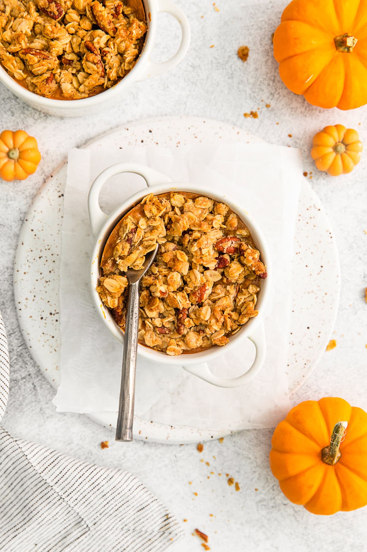 A spoon going into Pumpkin Crisp.