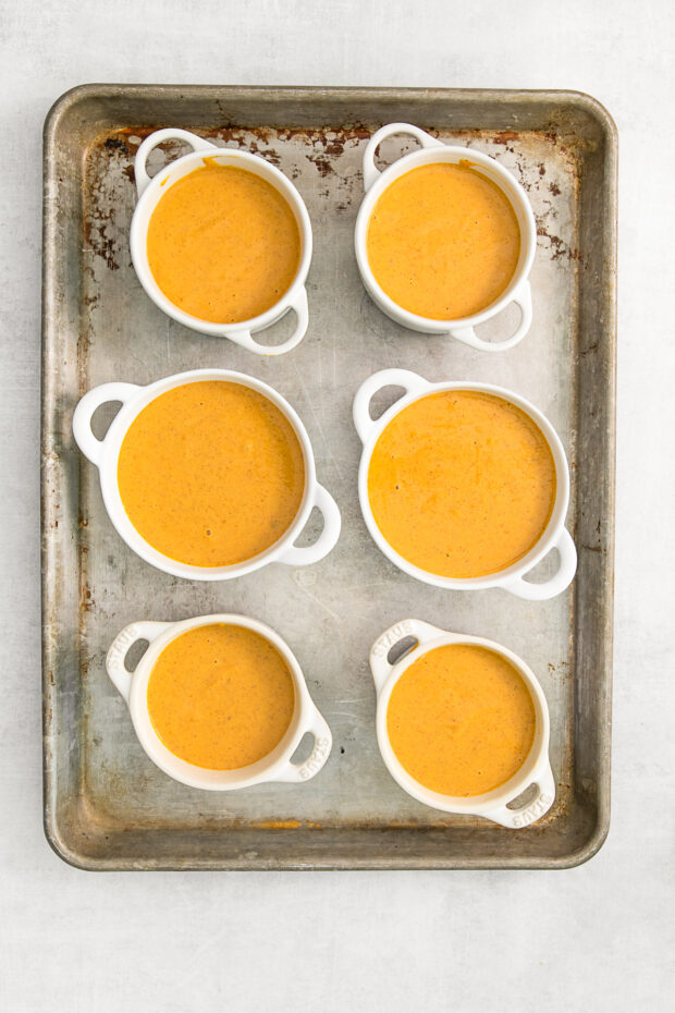 Uncooked pumpkin crisp in ramekins.
