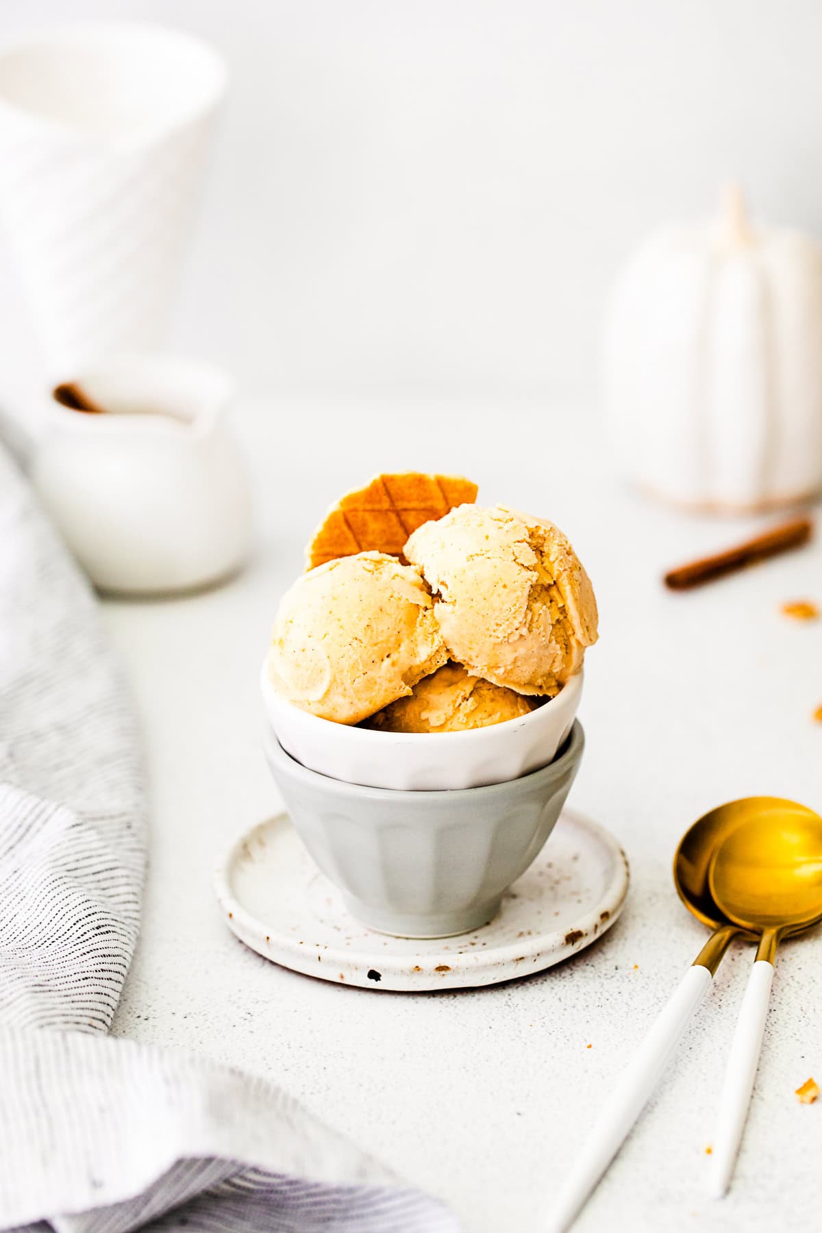 No-Churn Pumpkin Pie Ice Cream in a bowl with spoons.