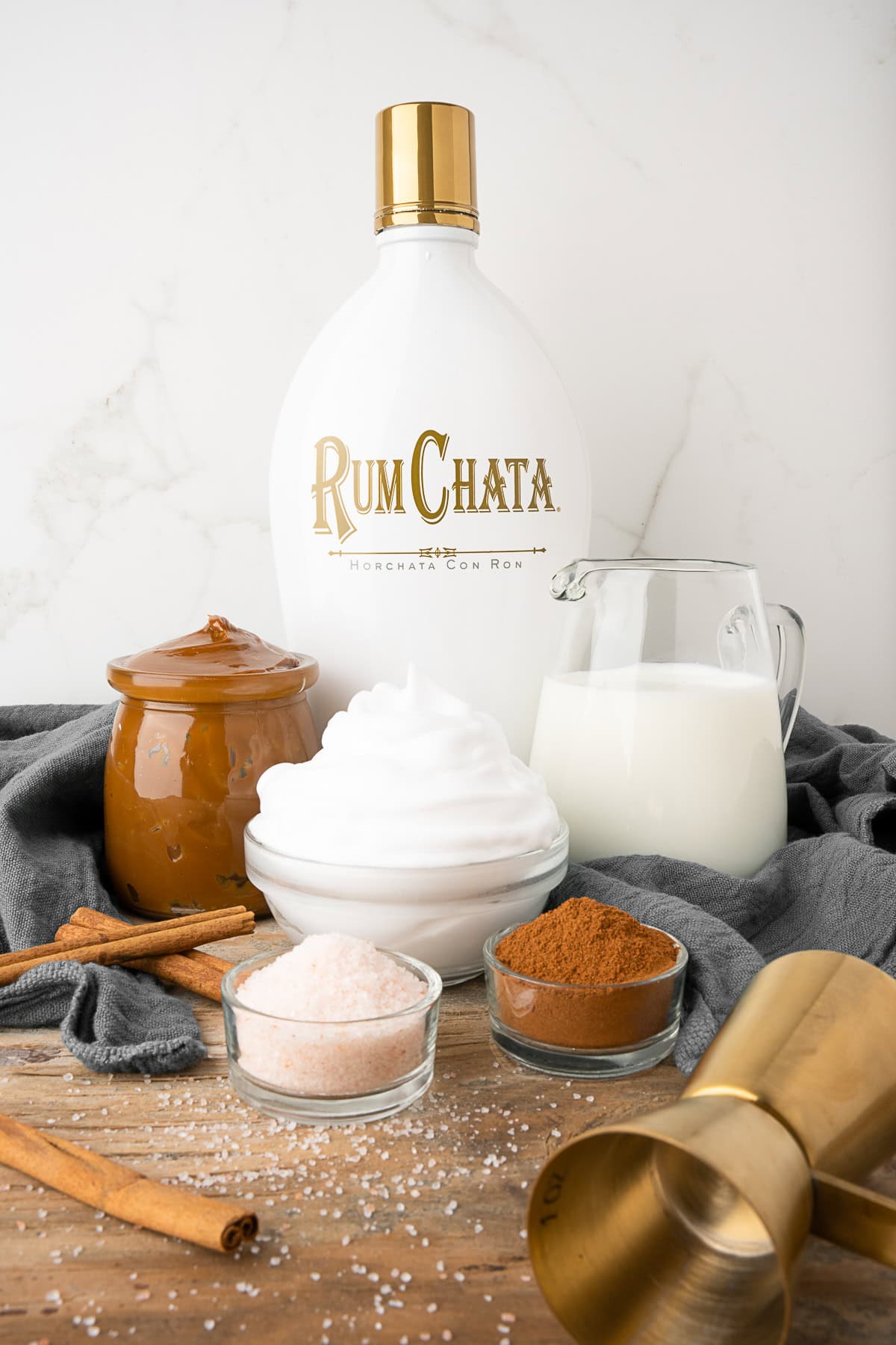 Ingredients to make Spiked Hot Dulce de Leche on a table. 
