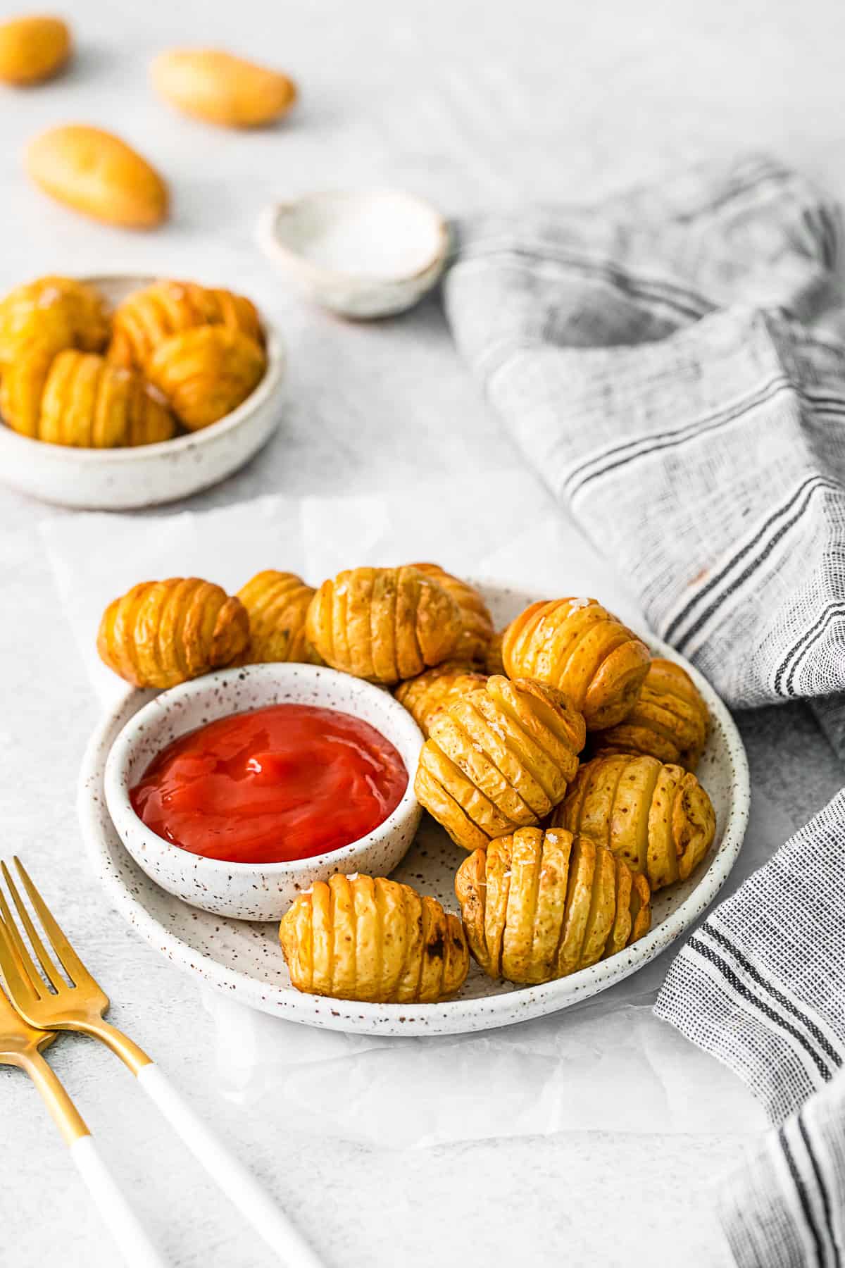 Air Fryer Hasselback Potatoes on a small plate.