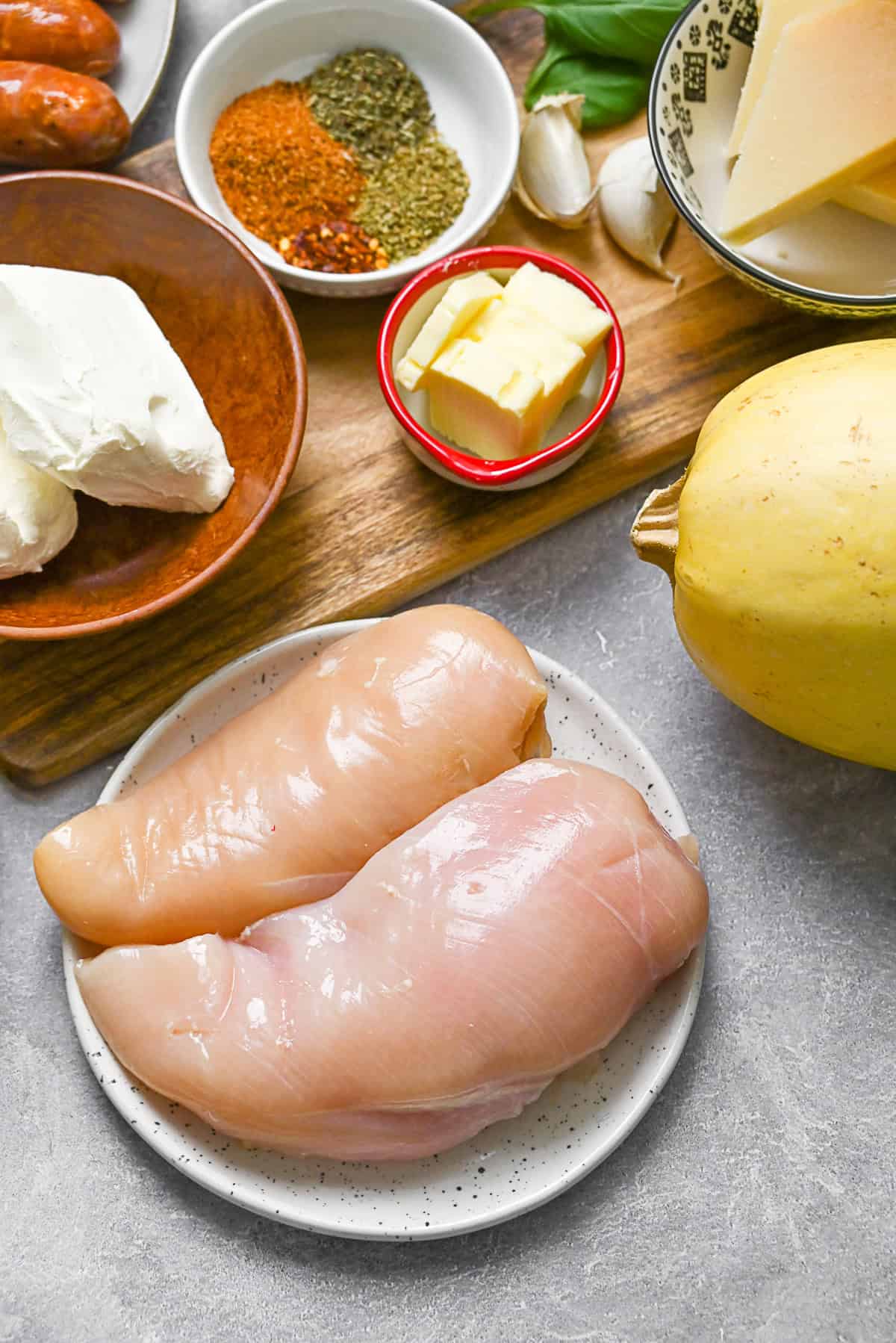 Ingredients to make Cajun Chicken Alfredo Spaghetti Squash on a table.