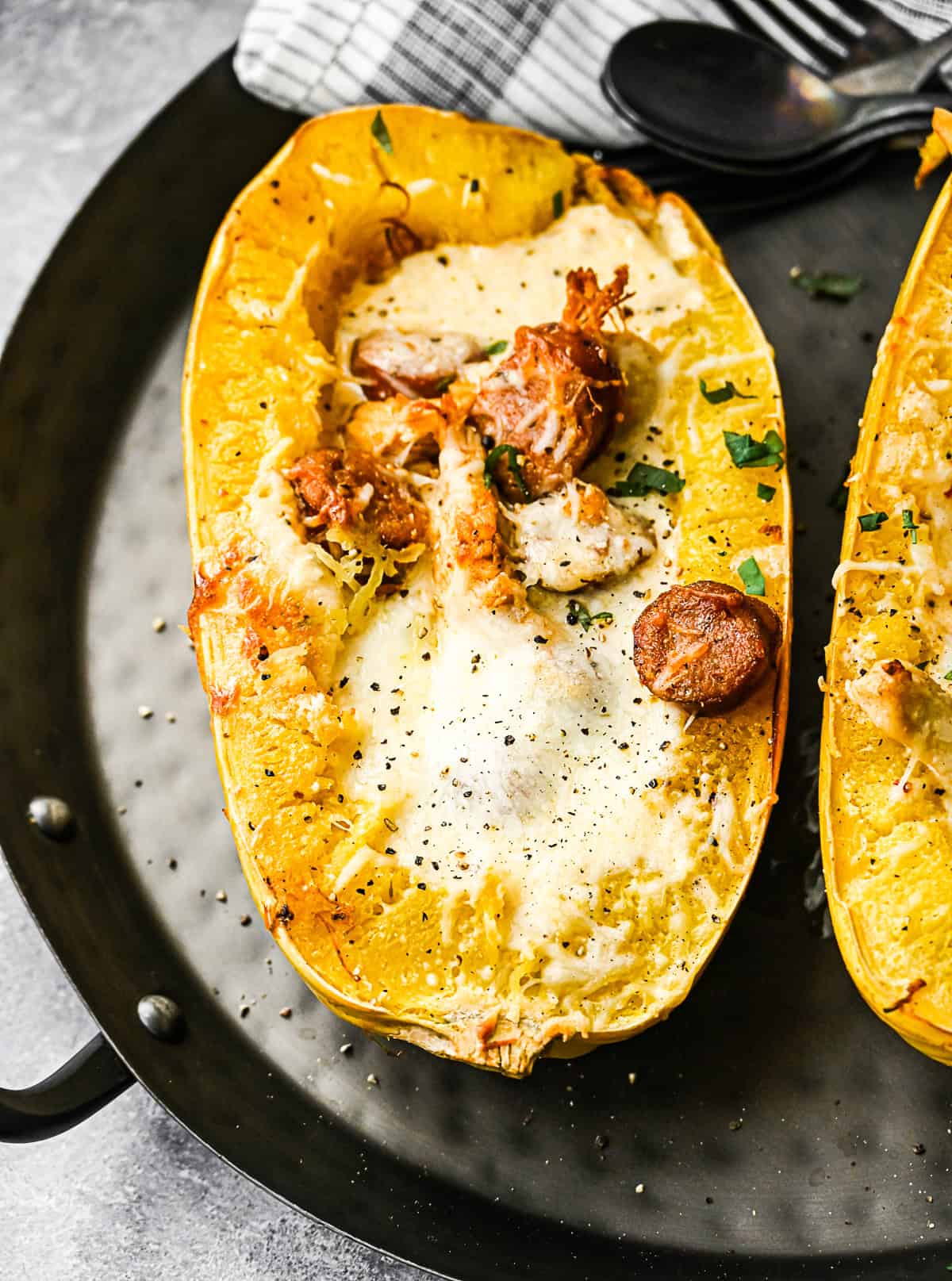 Cajun Chicken Alfredo Spaghetti Squash sprinkled with basil.