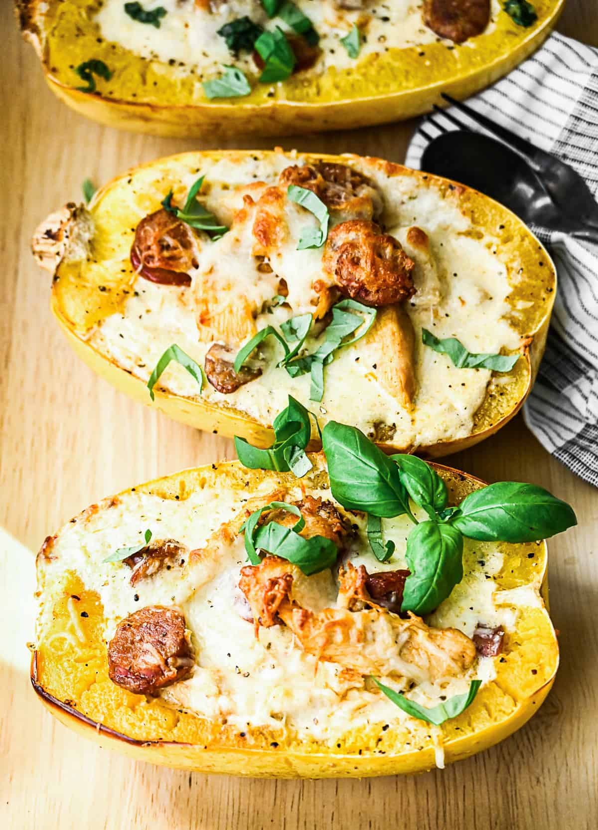 Cajun Chicken Alfredo Spaghetti Squash served with basil.